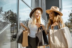 Two Woman Smiling Shopping Holding Bags