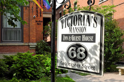 Sign at Front Sidewalk of Victoria's Mansion