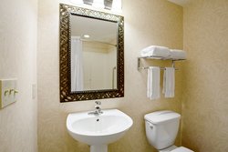 King Studio bathroom with standard amenities and separate vanity.