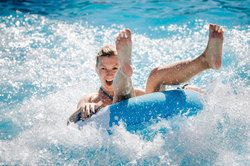 Laughing Woman On Water Tube