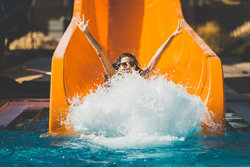 Woman Sliding Down Water Slide
