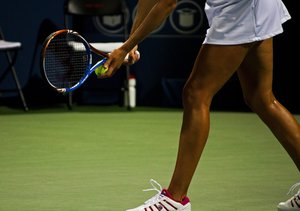 Woman playing Tennis at Courts Plus