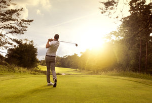Man Playing Golf In The Sun