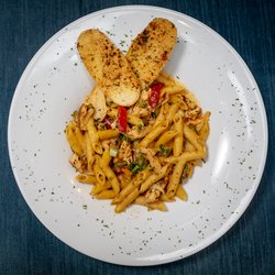 Spicy Jack Penne Pasta With Blackened Chicken And Garlic Bread