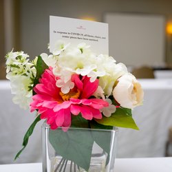 Conference Room Flowers With Covid Notice